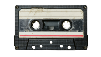 A used audio cassette tape.  Dark gray plastic case, dirty and worn.  Visible tape markings and discoloration.  Two circular holes in the center