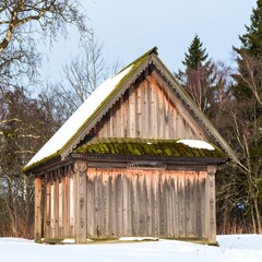 Wooden cabin in snowy landscape