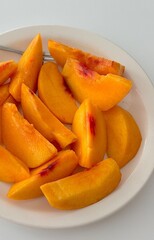 Sliced peach, showcasing its juicy, tender flesh and vibrant color. Perfect for summer recipes or fruit-related designs, this image highlights the refreshing taste and appeal of this delicious fruit.