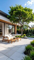 Modern outdoor patio area with a large tree