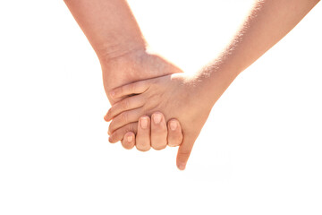Closeup of two children holding hands signifying friendship and trust.