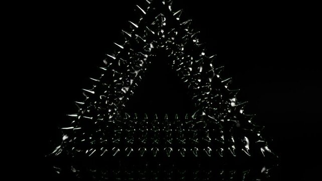 Ferrofluid spikes forming Penrose triangle with glossy highlights