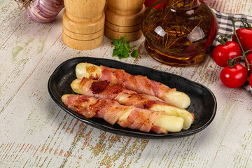 Hot mozzarella sticks with bacon