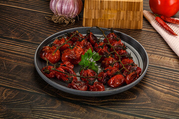 Baked cheeryy momatoes with olive oil