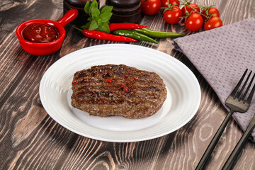 Grilled beef burger cutlet with sauce