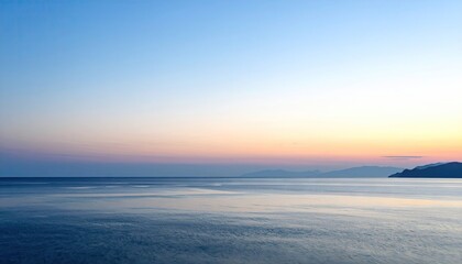 Muted Slate And Rose Sunset Over Calm Sea