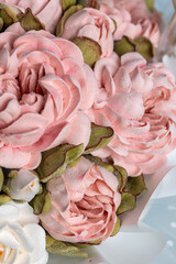 Beautiful arrangement of pink and white marshmallow flowers in a woven basket, showcasing intricate details and soft textures, perfect for decorative purposes and floral artistry