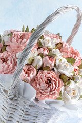Beautiful arrangement of pink and white marshmallow flowers in a woven basket, showcasing intricate details and soft textures, perfect for decorative purposes and floral artistry