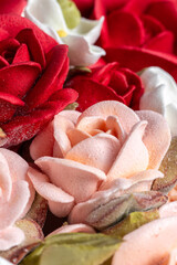 Beautiful arrangement of marshmallow flowers in a white round box, featuring vibrant red, soft pink, and delicate white blooms, showcasing unique floristry concept with copy space