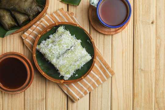 Kue lupis or lopis. Rice cake made from steamed glutinous rice and served with shaved coconut. indonesian traditional cake.