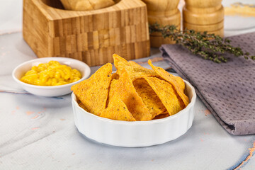 Corn nachos chips with cheese dip