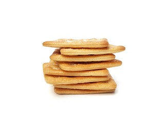 Pile of square sweet cracker biscuits isolated on white background 