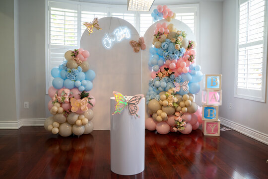 Baby shower decorations and event setup with balloon arrangements.