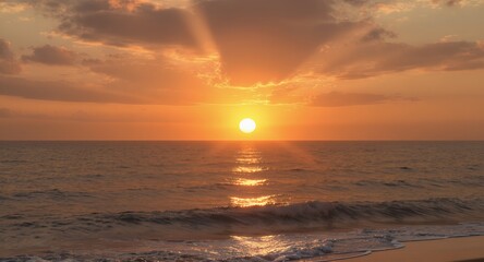Obraz premium Stunning Ocean Sunset with Golden Sky and Waves