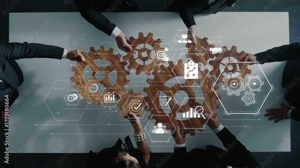 Poster aerial view of business professionals collaborating around a table with digital gears and icons, sym