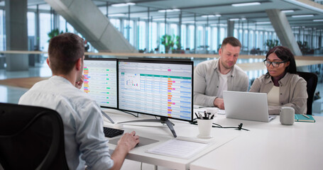 Team Using Spreadsheet Software For Billing Report Analysis