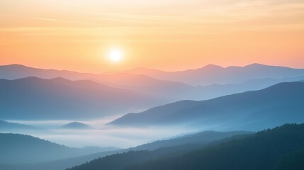 Sunrise over misty mountains with sun rising behind horizon casting warm hues across layers mountain peaks valleys serene peaceful scene capturing beauty nature dawn