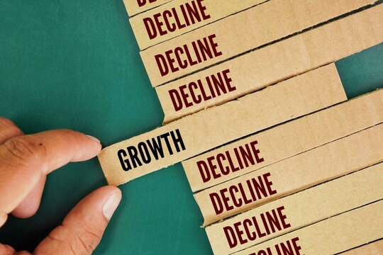 Square paper with two words growth or decline. refers to whether something is increasing or decreasing in size, quantity, or intensity over time