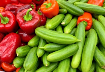 Vibrant Red Bell Peppers and Fresh Green Cucumbers