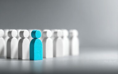 Single blue figure amidst a group of white figures
