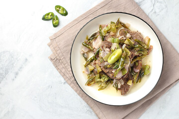 Dendeng batokok. Beef with green chili pepper authentic cuisine from West Sumatra Indonesia.