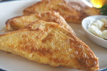 Delicious slices of toasted bread served with cheese