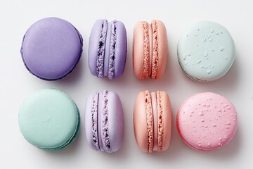 Obraz premium Colorful macarons arranged in a grid pattern on a white background