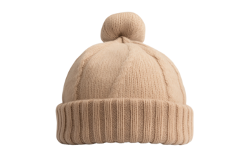 Cozy beige knitted beanie hat with a pom pom on a white isolated background.