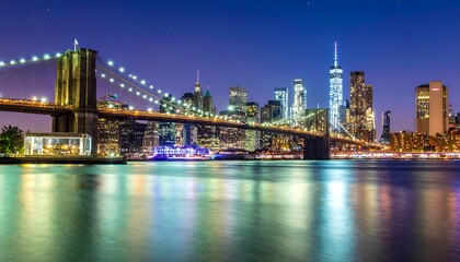 Fototapeta premium Night view of NYC skyline and bridge