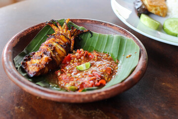 cumi bakar sambal. grilled squid with chili sambal.