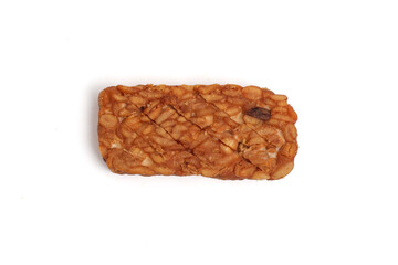 Tempe. Fried tempeh isolated on white background. fermented soy bean.