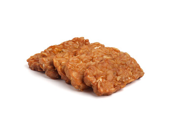 Tempe. Fried tempeh isolated on white background. fermented soy bean.
