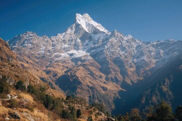 Majestic mountain peak, snow-capped,  and rugged terrain