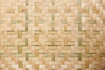 Traditional handwoven bamboo strips forming a crosshatch design.