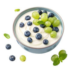A bowl of yogurt topped with blueberries and green grapes snack isolated on white background