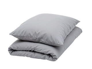 Soft gray pillows and a comforter stacked together in a minimalist style setting for relaxation