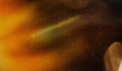 Grainy colorful warm rainbow red light leaks on black background with dust texture. abstract damaged scratched retro film analog effect for using over photos as overlay or screen filter