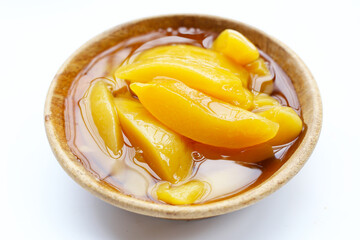 Sliced peaches in syrup served in a bowl