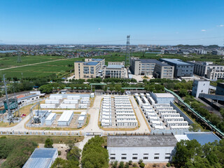 Aerial view of battery energy storage systems under a clear blue sky