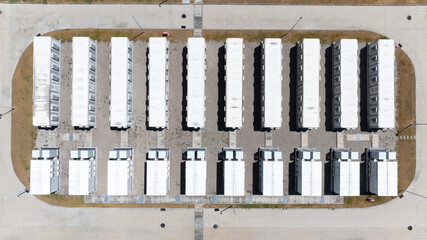Aerial view of battery energy storage systems under a clear blue sky