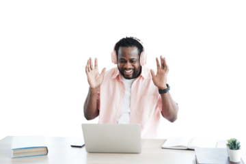 African American businessman listening to music with headphone and online working with laptop
