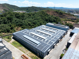 Aerial view of solar panels installed on building rooftop