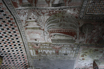ancient stone ceiling paintings of Dambulla cave temple in Sri Lanka