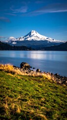 Snowy mountain over tranquil lake