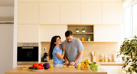 Cooking together in a modern kitchen fills the space with warmth and joy
