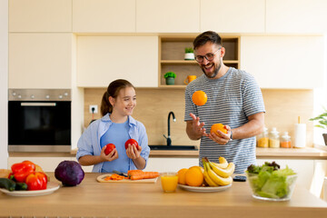 Joyful moments in a kitchen filled with fresh vegetables and fruits