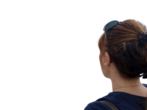 A woman looks ahead with calm determination, her sunglasses resting on her head. Her posture conveys focus and strength, symbolizing inner balance, quiet confidence, and readiness for new horizons.