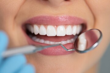 dentist examine woman teeth
