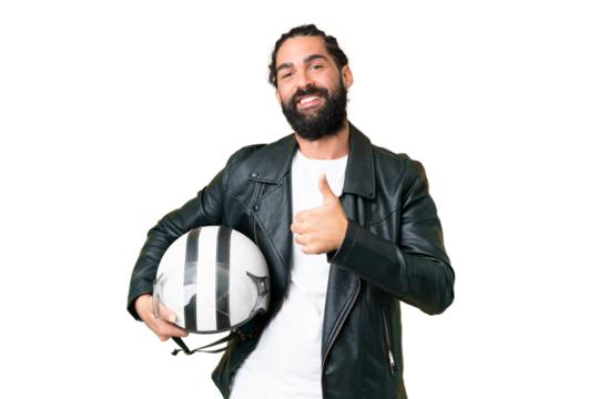Young man with beard with a motorcycle helmet over isolated chroma key background giving a thumbs up gesture