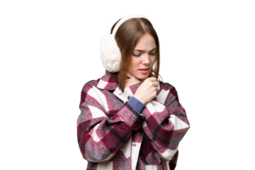Young pretty woman wearing winter muffs over isolated chroma key background is suffering with cough and feeling bad